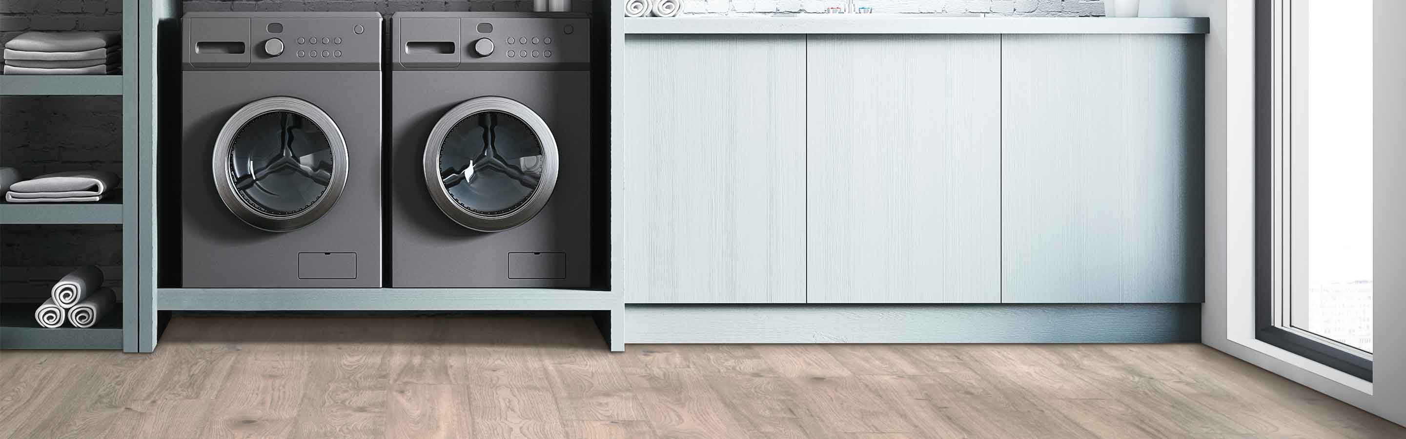 wood-look laminate flooring in modern laundry room with gray cabinetry